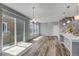 Bright living space features sleek, open-concept design, modern lighting, and beautiful wood floors at 3429 Hardin St, Castle Rock, CO 80109