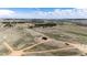 Panoramic aerial of land parcel showing home with surrounding acreage at 37094 Still Rock Pt, Elizabeth, CO 80107