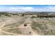 Expansive aerial view showcasing a modern home nestled within a vast, scenic landscape at 37094 Still Rock Pt, Elizabeth, CO 80107