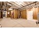 Unfinished basement features exposed ceiling and framing, offering customization options at 37094 Still Rock Pt, Elizabeth, CO 80107