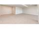 Unfinished basement with concrete floor and modern exposed ceiling and ductwork at 37094 Still Rock Pt, Elizabeth, CO 80107