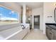 Luxurious bathroom with a freestanding tub, separate glass shower, and a dual vanity at 37094 Still Rock Pt, Elizabeth, CO 80107