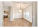 Bright dining area boasts hardwood flooring, recessed ceiling lighting and a modern light fixture at 37094 Still Rock Pt, Elizabeth, CO 80107