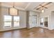 Bright foyer with natural light, hardwood floors, and decorative light fixtures creating a welcoming entrance at 37094 Still Rock Pt, Elizabeth, CO 80107