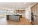Modern kitchen with stainless steel appliances, a large island, and elegant cabinetry with natural light at 37094 Still Rock Pt, Elizabeth, CO 80107