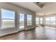 Bright and airy living room featuring large windows, hardwood floors and a walk out balcony at 37094 Still Rock Pt, Elizabeth, CO 80107