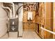 Utility room features modern water heater and HVAC with white piping at 37094 Still Rock Pt, Elizabeth, CO 80107