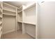 Well-organized walk-in closet featuring shelves and hanging rods at 37094 Still Rock Pt, Elizabeth, CO 80107