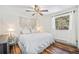 Cozy bedroom featuring wood floors, a queen sized bed and a decorative tapestry above at 11557 Green Cir, Conifer, CO 80433