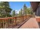 Spacious deck offering scenic views of the surrounding trees and mountains beyond at 11557 Green Cir, Conifer, CO 80433