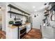 Functional kitchen featuring stainless steel appliances, open shelving, and a bright, airy atmosphere at 11557 Green Cir, Conifer, CO 80433