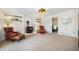 Spacious living area with plush carpeting, a fireplace, and comfortable seating at 11557 Green Cir, Conifer, CO 80433