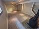 Finished basement with carpet, wood-burning stove and wood accents, perfect for a cozy living space at 3735 S Lewiston St, Aurora, CO 80013