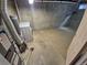 Unfinished basement laundry area equipped with a washer, water heater and dryer hookups for convenience at 3735 S Lewiston St, Aurora, CO 80013