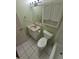 Bathroom featuring tile floors, single sink vanity and built in storage at 3735 S Lewiston St, Aurora, CO 80013