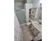 Bathroom featuring tile floors, glass shower door and single sink vanity at 3735 S Lewiston St, Aurora, CO 80013