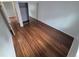 Bedroom boasts wood flooring and a mirrored closet, offering both style and practicality in the space at 3735 S Lewiston St, Aurora, CO 80013