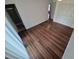 Bedroom featuring wood floors, closet, and an attached bathroom at 3735 S Lewiston St, Aurora, CO 80013