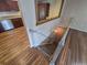 Inviting interior stairs with wooden floors that features a modern kitchen and dining area at 3735 S Lewiston St, Aurora, CO 80013