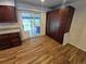 A kitchen boasts wooden cabinets, stainless steel appliances, and access to the backyard at 3735 S Lewiston St, Aurora, CO 80013