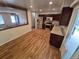 Open kitchen featuring stainless steel appliances, granite countertops, and wood flooring at 3735 S Lewiston St, Aurora, CO 80013
