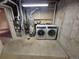 Laundry area with washer and dryer, water heater, and exposed ductwork at 3735 S Lewiston St, Aurora, CO 80013