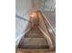 Staircase with neutral carpet and decorative railings offers a safe and stylish transition between levels of the home at 3735 S Lewiston St, Aurora, CO 80013