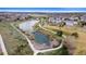 Community aerial view with lakes, walking paths, green space, and neighborhood homes at 12770 Jasmine Ct, Thornton, CO 80602