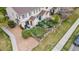 Aerial view of a townhouse backyard featuring a small patio, grass, and gravel at 12770 Jasmine Ct, Thornton, CO 80602