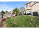 Lawn with grass leading to a patio and fenced area; space for outdoor fun at 12770 Jasmine Ct, Thornton, CO 80602