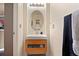 Modern bathroom featuring a sleek vanity, oval mirror, and contemporary fixtures at 12770 Jasmine Ct, Thornton, CO 80602