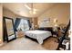 Comfortable bedroom featuring a ceiling fan, sitting area, and relaxing decor at 12770 Jasmine Ct, Thornton, CO 80602