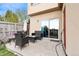 Outdoor patio area with seating and sliding glass doors for easy indoor-outdoor living at 12770 Jasmine Ct, Thornton, CO 80602