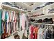 Spacious walk-in closet with ample shelving and hanging space for organized storage at 12770 Jasmine Ct, Thornton, CO 80602