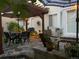 Charming backyard patio featuring stone pavers, a pergola, and an outdoor dining set at 3183 W 114Th Loop, Westminster, CO 80031