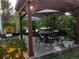 Cozy backyard patio with a pergola, outdoor furniture, and lush landscaping at 3183 W 114Th Loop, Westminster, CO 80031