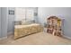 Charming bedroom with a bed, dollhouse and bright natural light at 3183 W 114Th Loop, Westminster, CO 80031