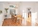 Formal dining room with a chandelier, large window, and hardwood floors at 3183 W 114Th Loop, Westminster, CO 80031