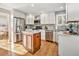 Modern kitchen featuring white cabinets, stainless steel appliances, and a central island at 3183 W 114Th Loop, Westminster, CO 80031