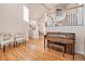 Open living room with hardwood floors, a staircase, and natural light at 3183 W 114Th Loop, Westminster, CO 80031