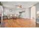 Comfortable living room featuring hardwood floors, a ceiling fan, and ample natural light at 3183 W 114Th Loop, Westminster, CO 80031