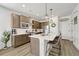 Modern kitchen with stainless steel appliances and an island with seating at 9275 Merino Ct # A, Littleton, CO 80125