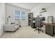 Functional home office with built-in shelving and comfortable seating at 9275 Merino Ct # A, Littleton, CO 80125