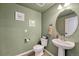 Chic powder room with updated fixtures and a modern pedestal sink at 9275 Merino Ct # A, Littleton, CO 80125