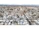 Wide aerial view of snowy neighborhood at 1770 Akron St, Aurora, CO 80010