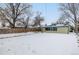 House backyard with snow and wooden fence at 1770 Akron St, Aurora, CO 80010