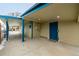 Covered patio with blue door and concrete flooring at 1770 Akron St, Aurora, CO 80010