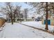 House backyard with snowy landscape and shed at 1770 Akron St, Aurora, CO 80010