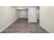 Unfinished basement with grey vinyl flooring at 1770 Akron St, Aurora, CO 80010