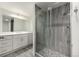 Modern bathroom with a walk-in shower and quartz vanity at 1770 Akron St, Aurora, CO 80010